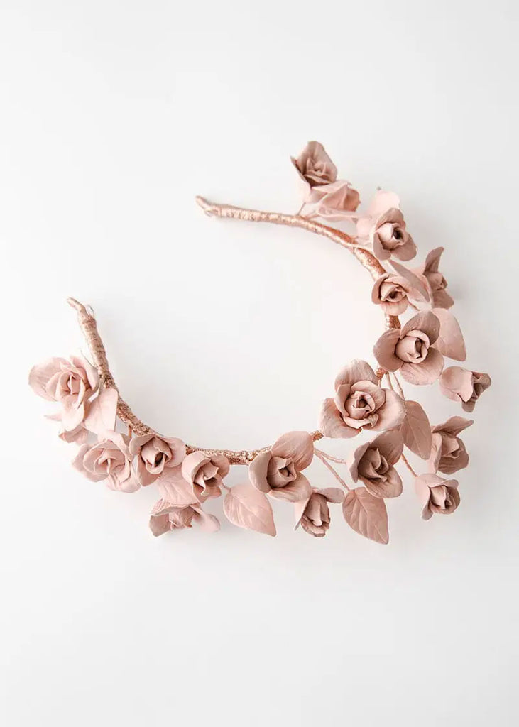 Custom pink flower crown in a modern shape on a headband.
