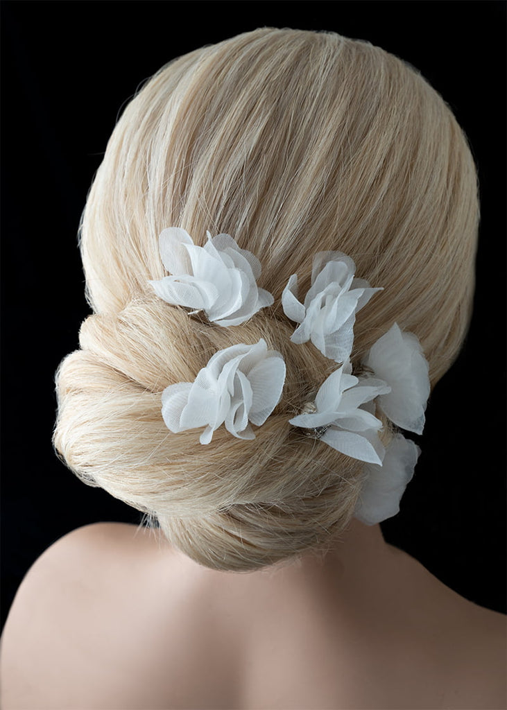 Silk flower hair pin in a set of six. A single flower on each pin with metal leaves that cup at the bottom of the flower