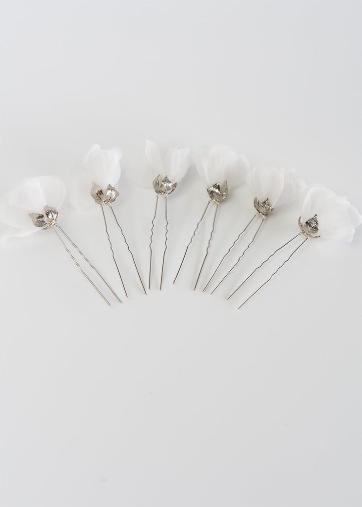 Silk flower hair pin in a set of six. A single flower on each pin with metal leaves that cup at the bottom of the flower