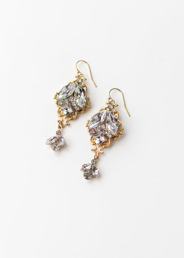 Esther bridal earrings have rhinestones that are in the middle and are set on a lovely filigree back & have a pretty drop