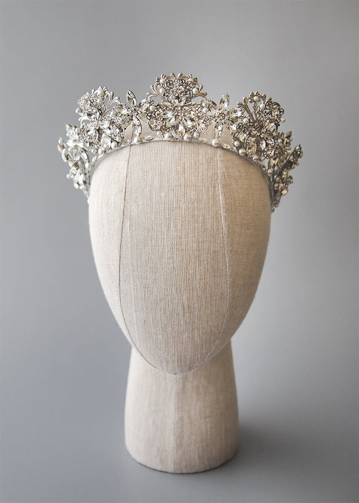 Everleigh crown has pretty filigrees with hand beading of pearls and rhinestone spread out over the headpiece.
