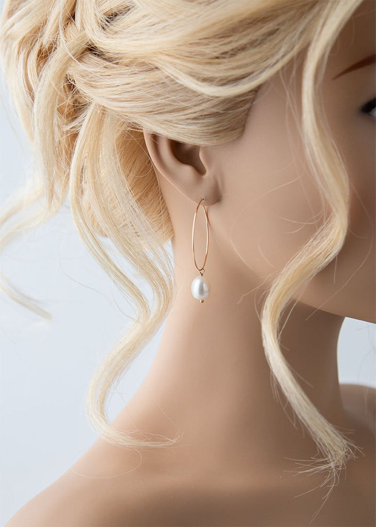 Gracelyn pearl earrings in a simple drop hoop design