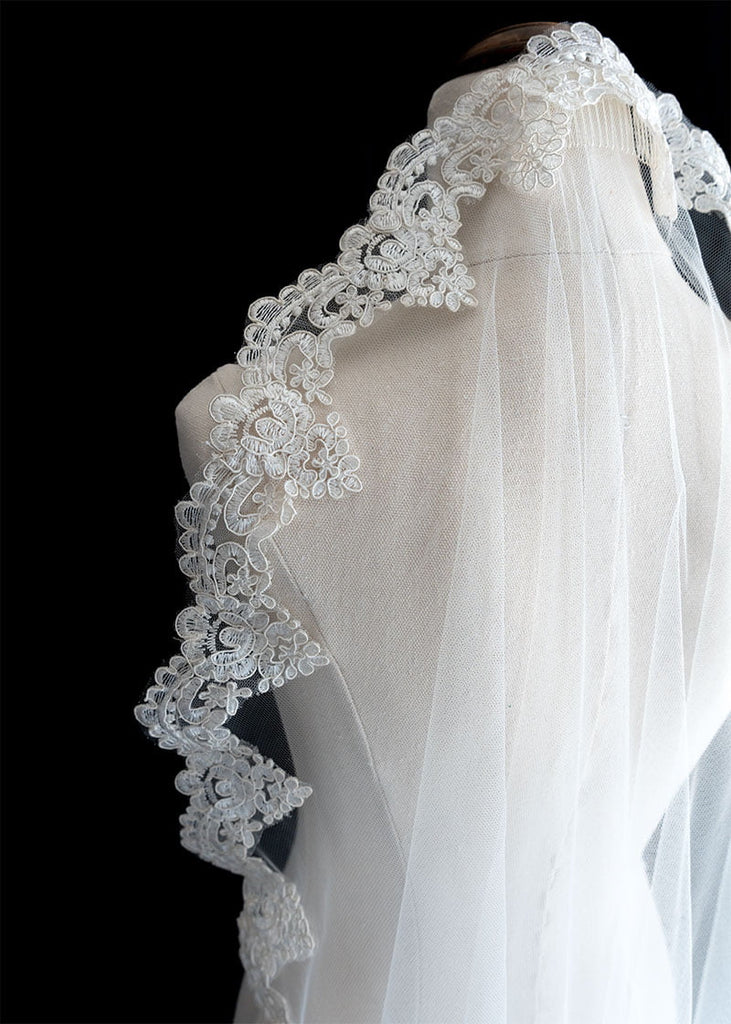 Gracie mantilla veil has a scallop corded lace along it entire edge.