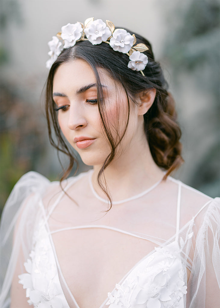 headpiece with seven handmade flowers on a headband.