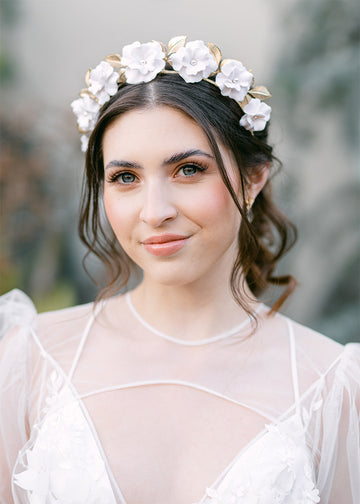 Bridal tiara style with eight petal handmade flowers and gold leaves.