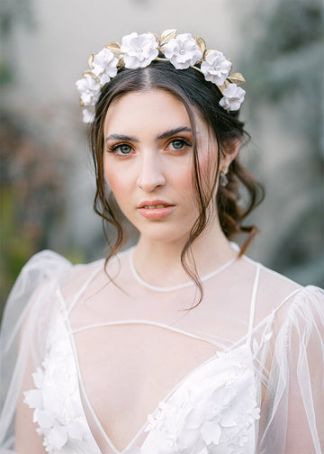 Medium size gold or silver leaves with white handmade flowers on a headband.