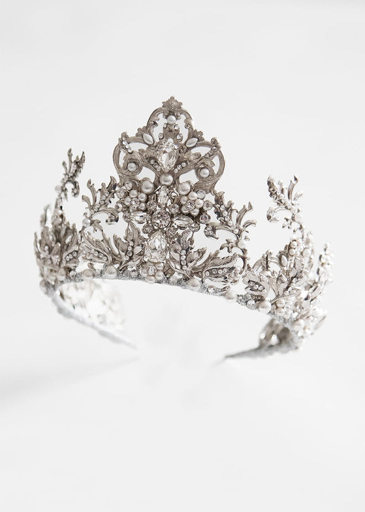 Kristina is a statement wedding crown that is tall and come to a peak in the middle with lots of hand beading.