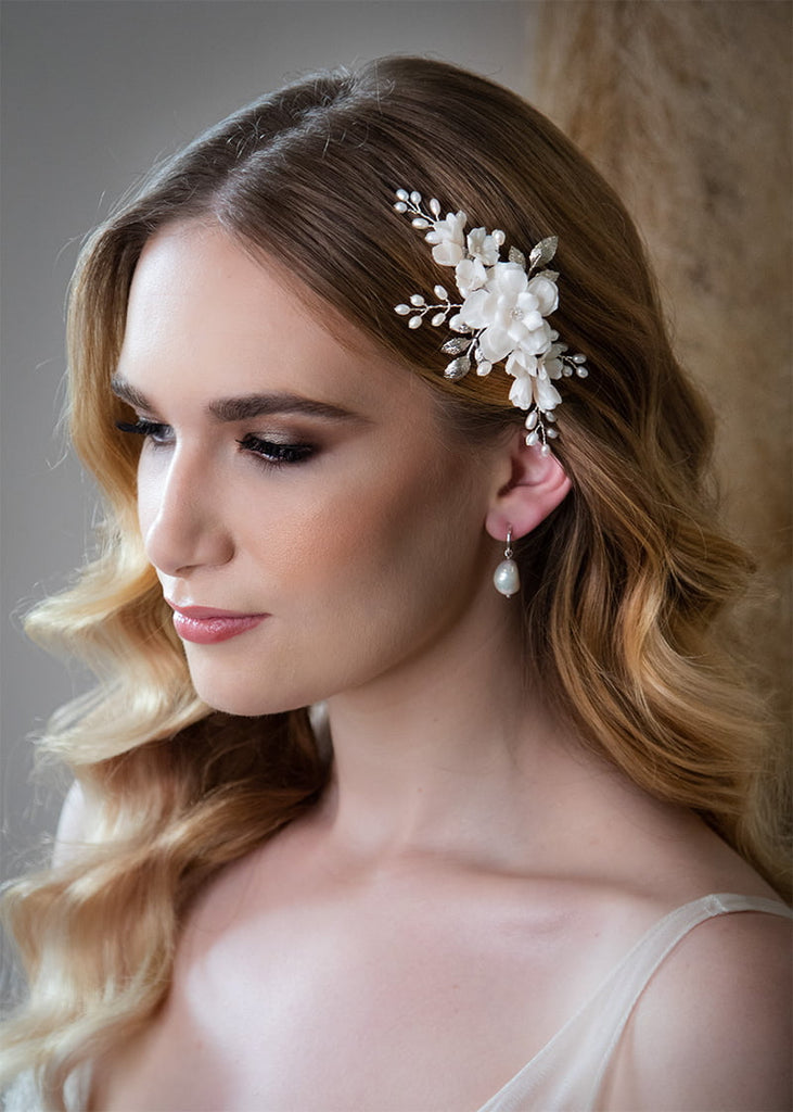 Flower comb for a brides wedding day. with pearl sprig and metal leaves.