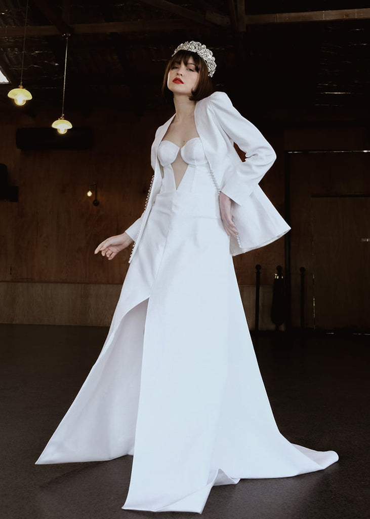 Olympia statement tiara is 6 cm tall with an abundance of hand beading of rhinestone and pearls. It has metal filigrees and leaves for the base of the design.