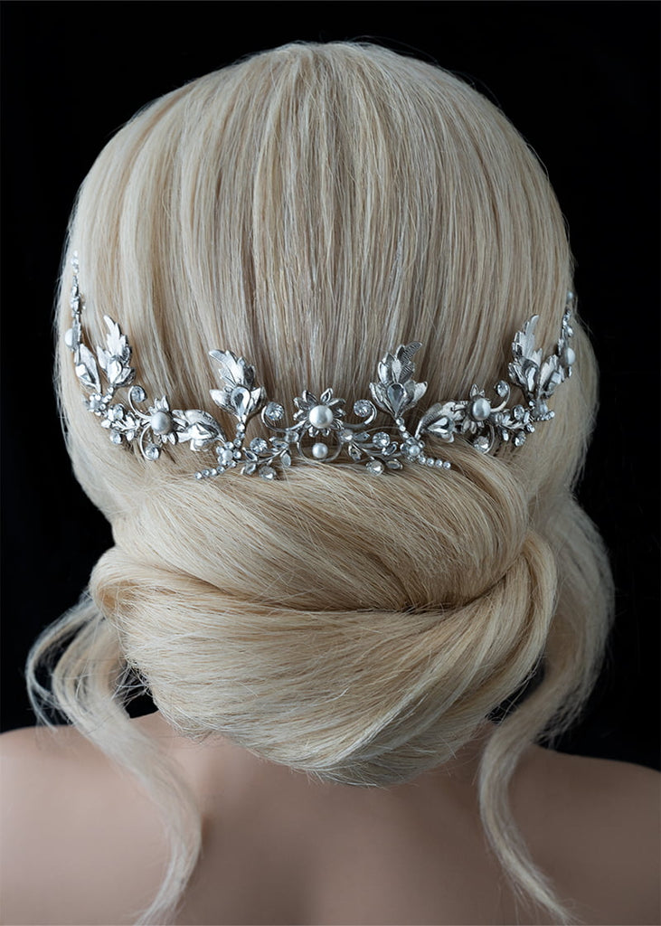 Sonnet headpiece has mixed shaped metal leaves arranged in a long narrow style with pretty arrangement of hand beaded pearls and rhinestones.
